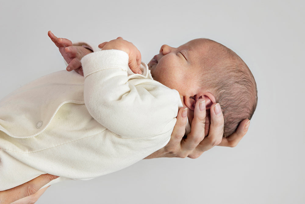 Newborn in Organic Clothing Suit
