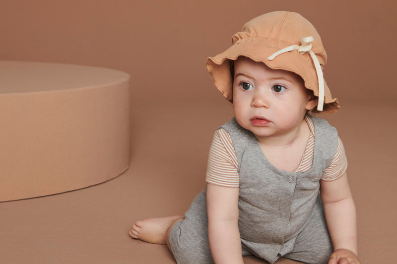 Girl in new baby bodysuit 