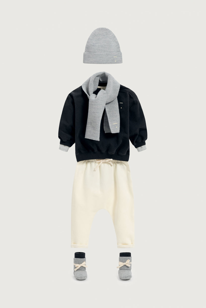 Outfit for a baby with grey, black and cream colors